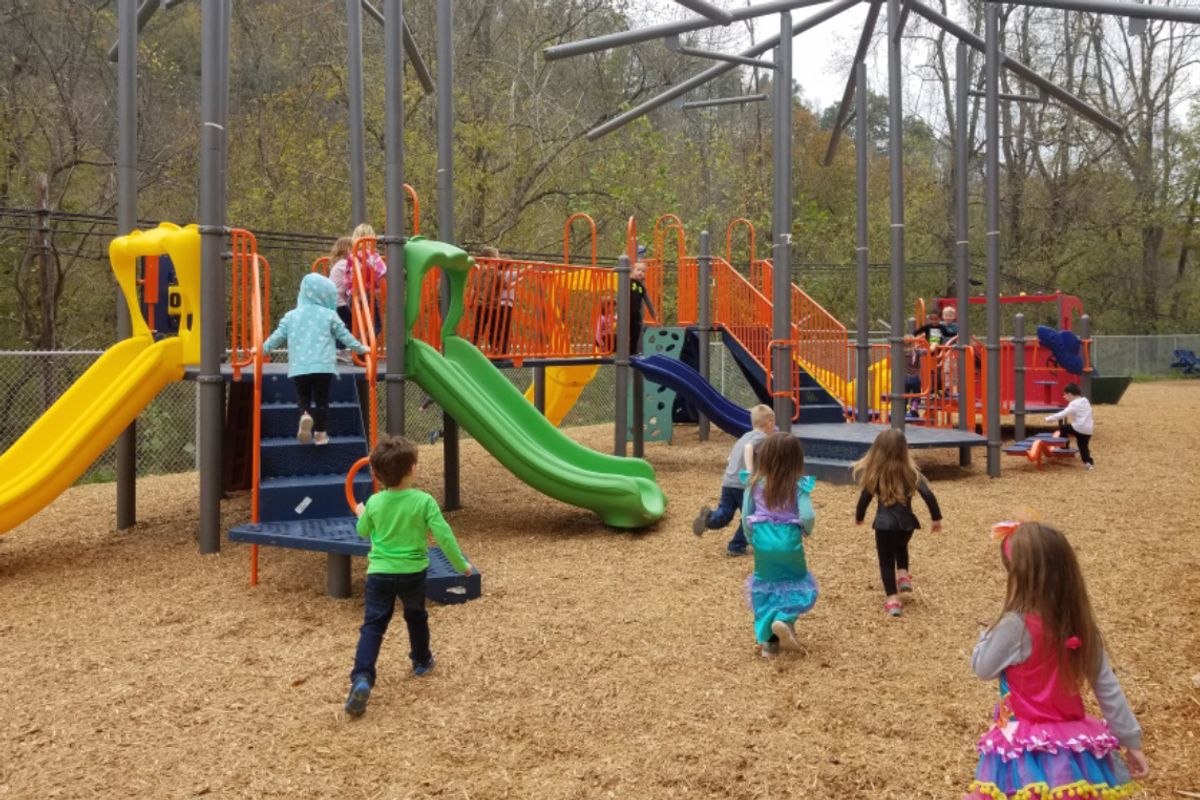 Children gather on a playground