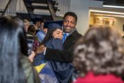 Father hugs daughter after commencement 