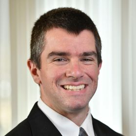 Rodney Hughes is pictured here wearing a dark suit and tie. He is an assistant professor of higher education administration in the College of Applied Human Sciences at WVU. 