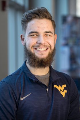 smiling young man with beard