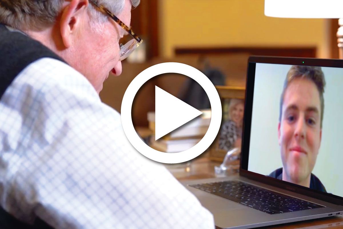 A photograph of Gordon Gee talking to a student via Facetime.