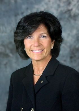 smiling woman with short dark hair