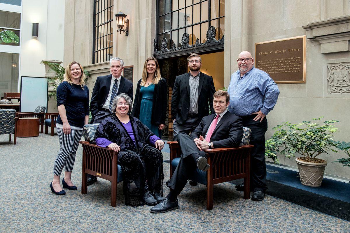 Honors Faculty Fellows 2018 in group, two are seated, five are standing