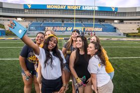 Class of 2020 members from left: Juana Baires, Asia Taylor, Nicole Gowland; Olivia Van Hoff, Sophia Keith, Jonnie Upton, Madison O'Donnell, Kerilynn Willemsen pose for a selfie as they attend Monday Night Lights during Welcome Week 2016.