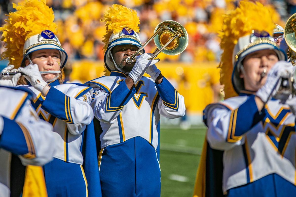 marching band members hold trombone and flute