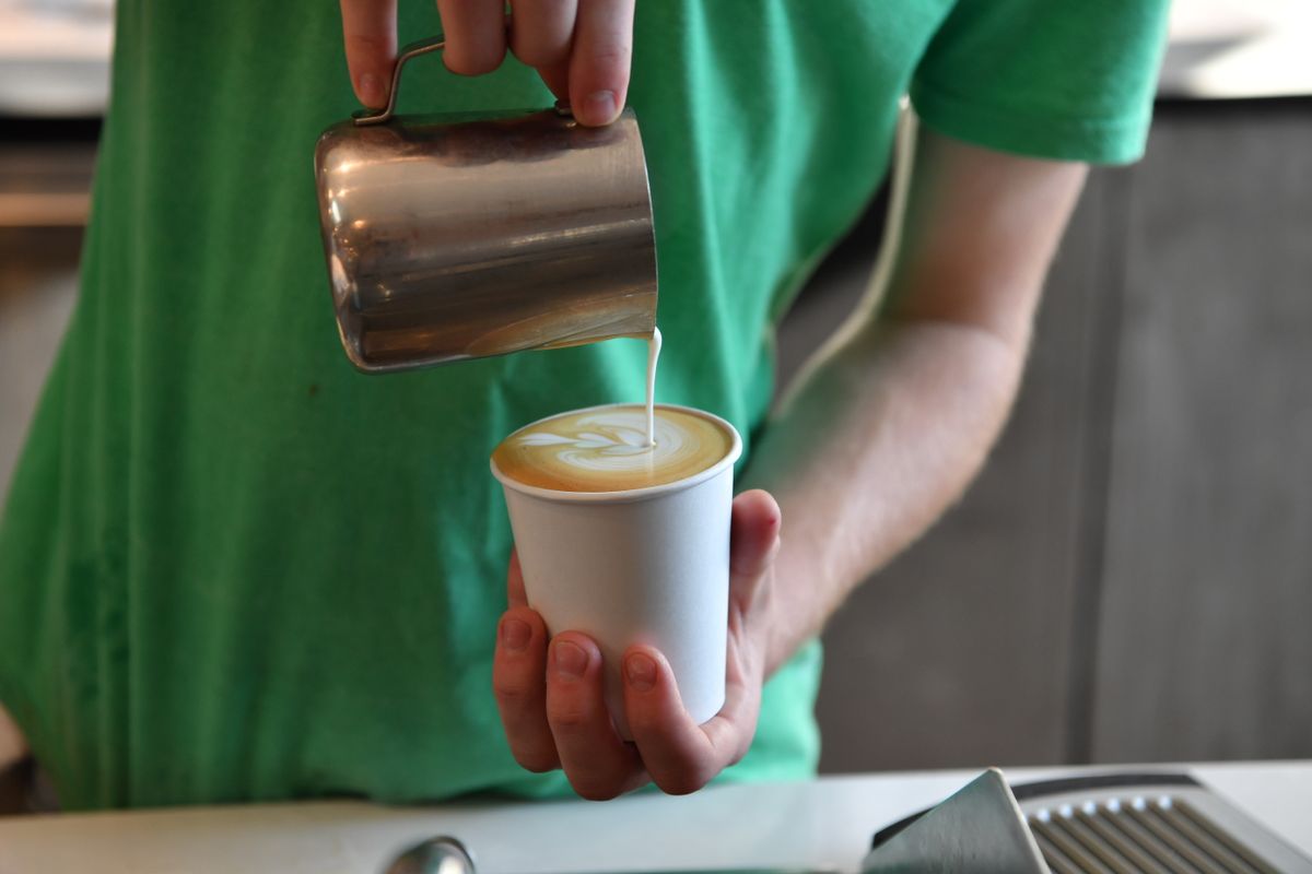 barista making latte