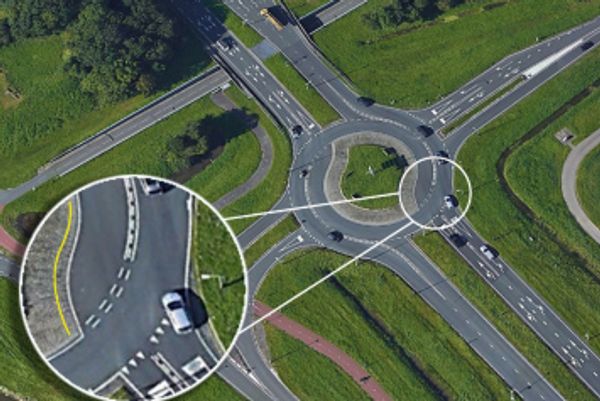 An aerial view of cars in a roundabout