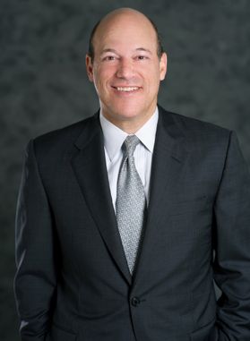 smiling man in suit and tie