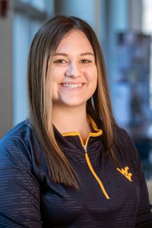 smiling woman in WVU jacket