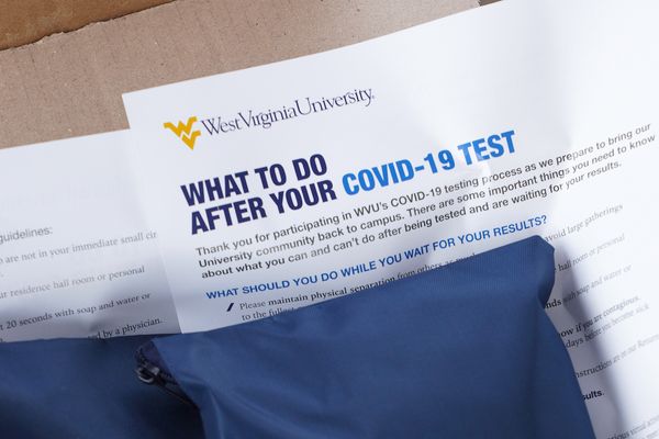 WHAT TO DO AFTER YOUR COVID-19 TEST on paper under blue packet